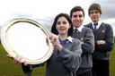 Alana Powell, 16, chairwoman, James Agar, 15, speaker and Seb French, 15, questioner, with a trophy won earlier