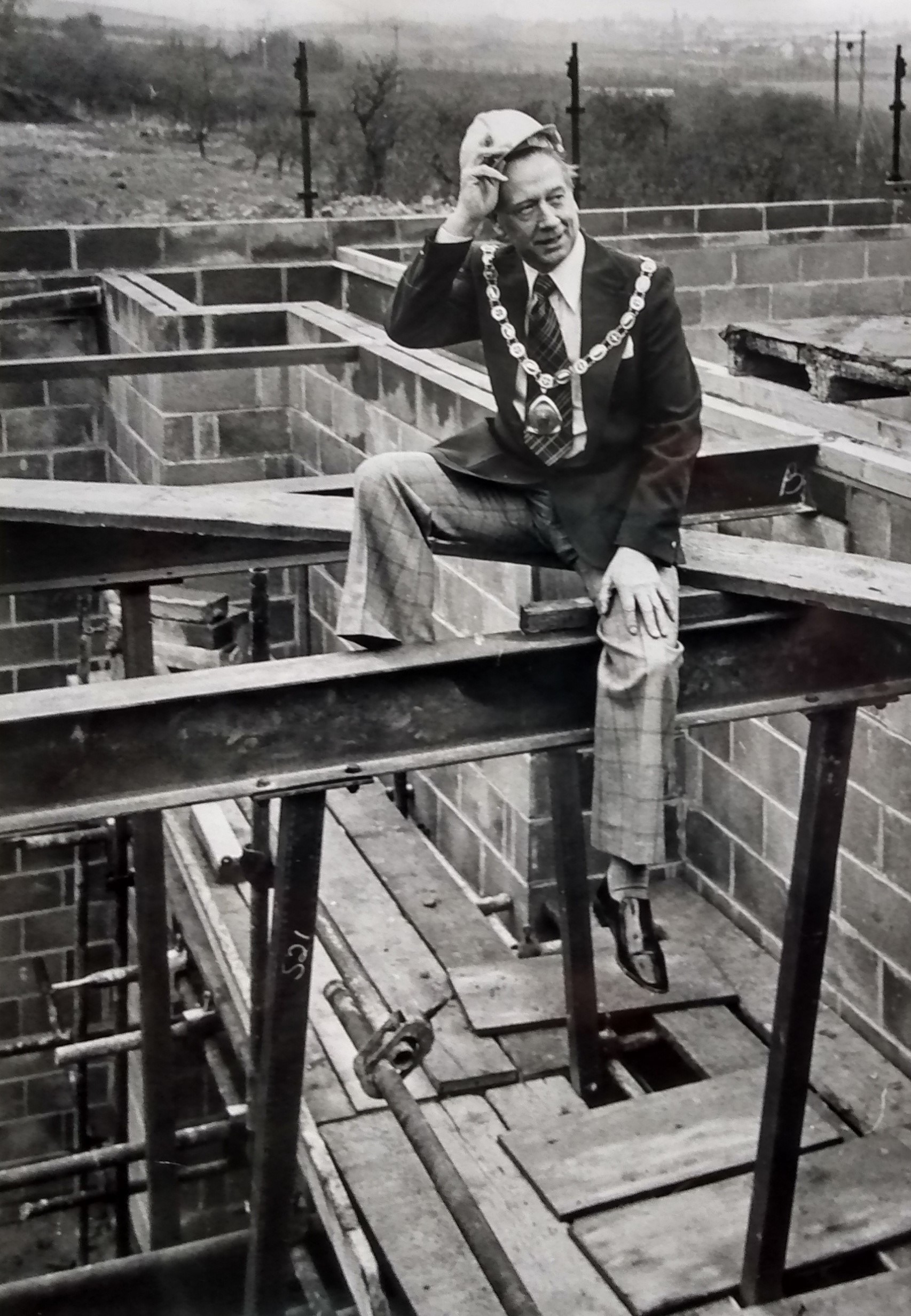 April 1978 and Cllr Jack Beckley, Wychavon chairman tries his hand at being Spiderman at the topping out ceremony at the Princes Theatre at Prince Henry High School