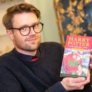 Jim Spencer with one of several Harry Potter first editions he has uncovered