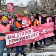 Striking posties in Chipping Norton brave the cold to make their voices heard