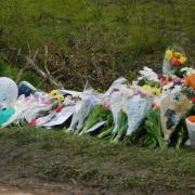 Flowers have been laid at the scene of the crash, on the B4035 Campden Road