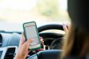 A woman from Chipping Campden is due in court this week after police caught her using a phone whilst driving. Picture: Getty/FatCamera