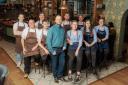 General manager Matt Hiscoe (in blue striped shirt) with The George’s front of house and kitchen teams