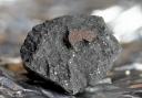 A fragment of the Winchcombe meteorite, which experts believe holds key information about the origins of life on earth. Credit: PA