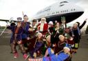 Flying First Class into Christmas: Father Christmas and his elves on the world's first Christmas Grotto experience on board a retired British Airways Boeing 747 Negus Jumbo Jet at Cotswold Airport, Kemble, Gloucestershire. Odin Events and Cotswold