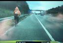 Police pull over a food delivery cyclist - spotted pedalling along a motorway
