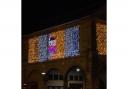 Lights designed by Children's Christmas Competition winners from over the years decorate Witney Town Hall