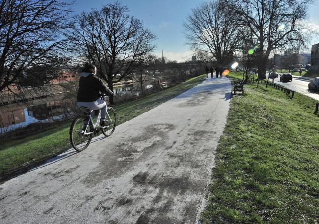 WEATHER WARNING: A cyclist rides over the ice on the bund next to Hylton Road in 2019