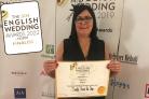Liz Devine Wright, of Simply Devine, pictured with her award from the 2019 English Wedding Awards - she is a contender for two categories in the 2022 awards.