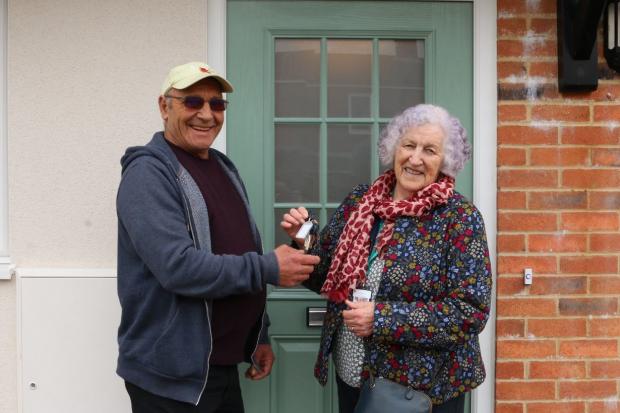 Tenant Andrew Wilson receives his keys from SDC chair of housing Cllr Mattie Ross