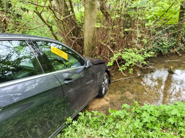 Cotswold Journal: Firefighters attended a car which ended up in a river, in Swerford. Picture: Oxfordshire Fire and Rescue Service