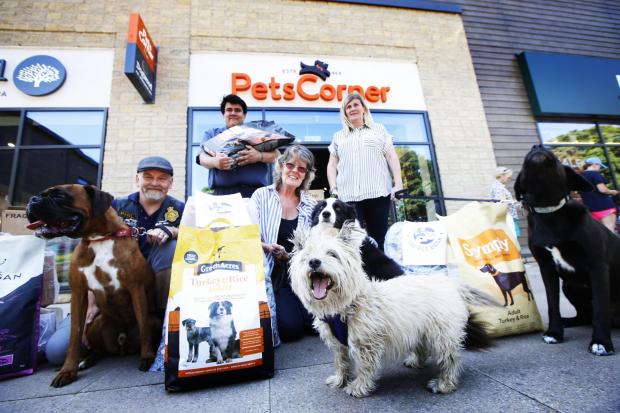 Cotswold Journal: Bonnie Cowdrey (centre) with donations for the Chipping Norton Pet Food Bank, upon its launch in June 2020. Picture: Ed Nix