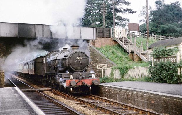 Cotswold Journal: The Worcester-bound 'Cathedrals Express' passes slowly through Fladbury in the summer of 1963 (there was a long-term speed restriction here over the R. Avon bridge at the time). The locomotive is No. 7005 Sir Edward Elgar, it had been renamed in 1957 to commemorate the centenary of the composer's birth. Picture: Michael Clemens