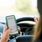 A woman from Chipping Campden is due in court this week after police caught her using a phone whilst driving. Picture: Getty/FatCamera