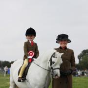 The Moreton Show will return later this year. Here Rowfantina Hideaway Harry, ridden by Emily Cooper, celebrates winning the Horse of the Year Show M&M Lead Rein Qualifier at the 2021 event