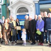 Campaigners hand in letter to at Mr Courts' constituency office on Witney High Street