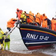 Asylum seekers coming ashore