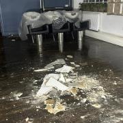 Firefighters had to remove the ceiling after a water leak flooded the salon