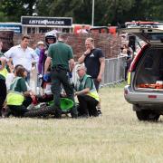 Cotswold Show stewards and first aid team helping the rider after the accident