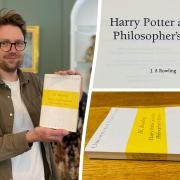 SWNS reporter with early proof copy of first Harry potter book which was found at a school in
