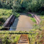 COMPLETE: The work to restore the banks of the River Isbourne and the railway line have been completed.