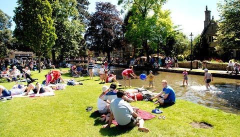 PICTURESQUE: tourists soak up the sun in Bourton-on-the-Water.