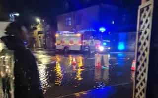 Fire crews had to save several businesses on Bourton High Street from flooding last night